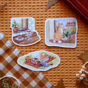 Lot de stickers "Coins cosy d'automne" par chatdudesert. Photo prise de face avec vue éloignée sur l'ensemble des stickers qui composent le lot.
