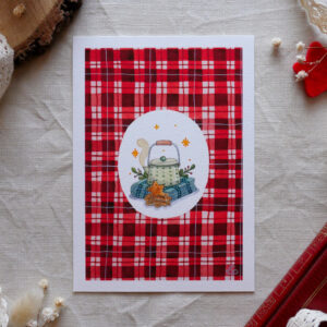 Reproduction de l'aquarelle "Tartan et boisson chaude" par chatdudesert. Photo prise de face, vue d'ensemble sur l'illustration.